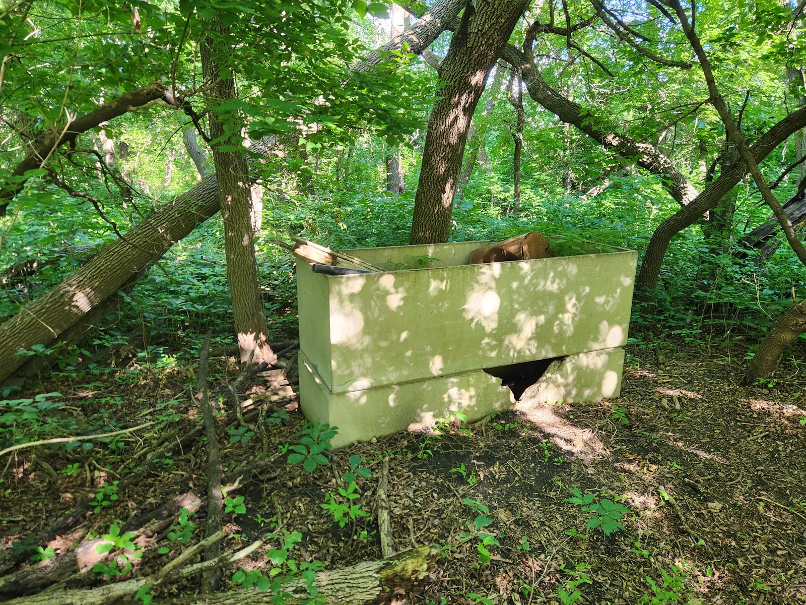 Along the red river on the lions MTB trail a couple of cement boxes standing on top of one another resembling a giant toolbox.